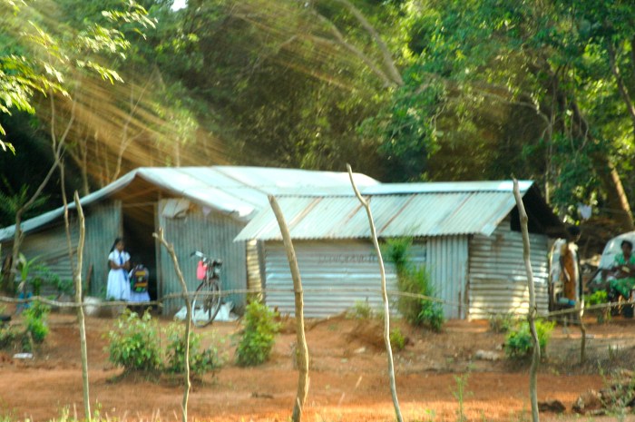 New homes with kids in white uniforms getting ready for school